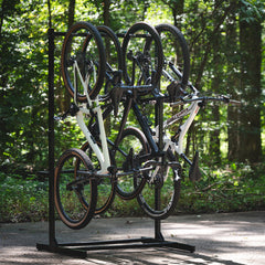 Five bikes hanging vertically on the G-Bike freestanding rack outdoors