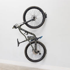 Single bike hanging on a swivel wall hook