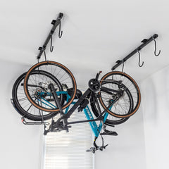 Two bikes hanging upside down from the G-Bike ceiling rack