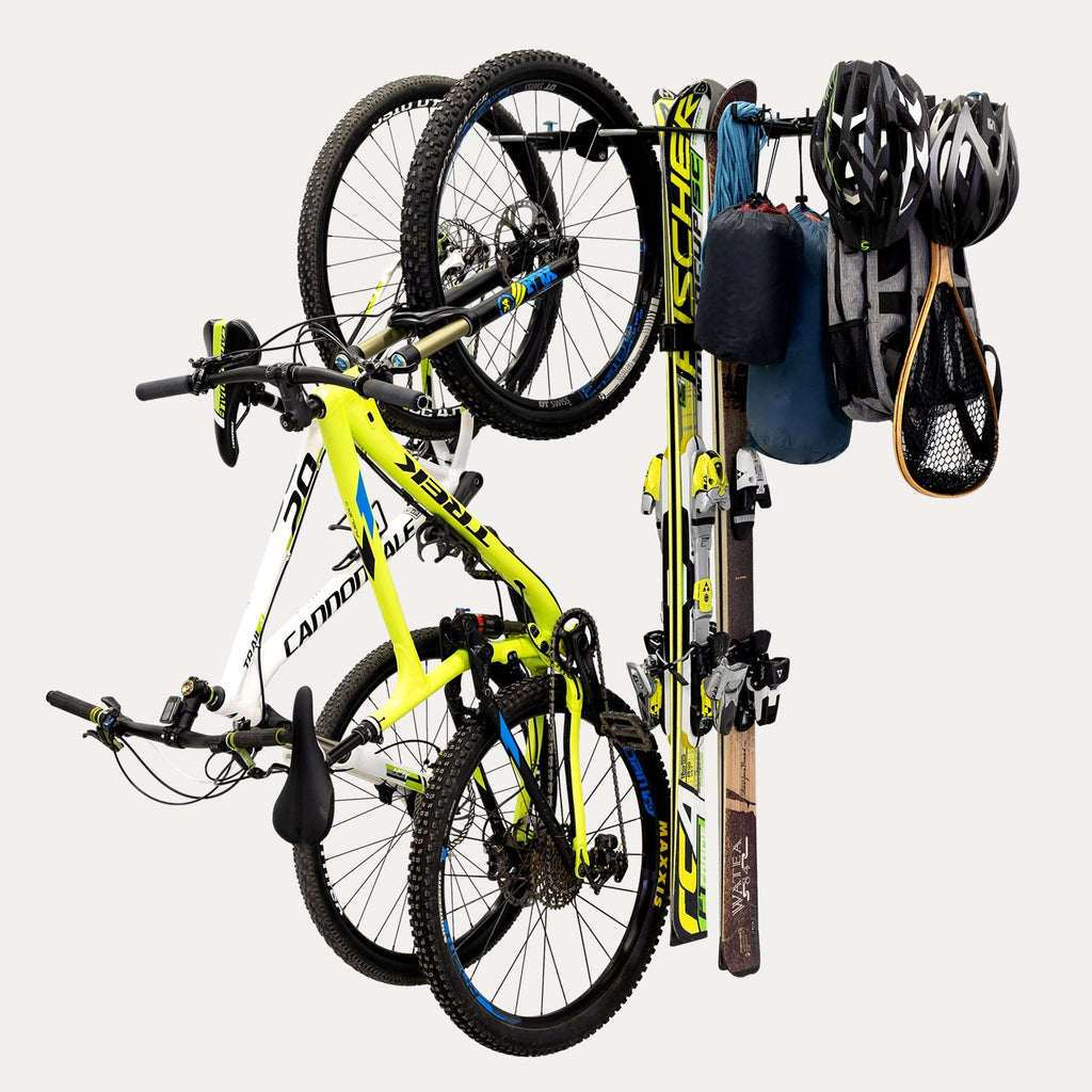 G-Adventure wall rack holding two bikes, skis and helmets