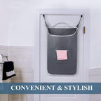 Gray over-the-door laundry hamper installed on a bathroom door
