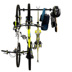 Two bikes, skis, a helmet and a bag on the G-Adventure rack, front view