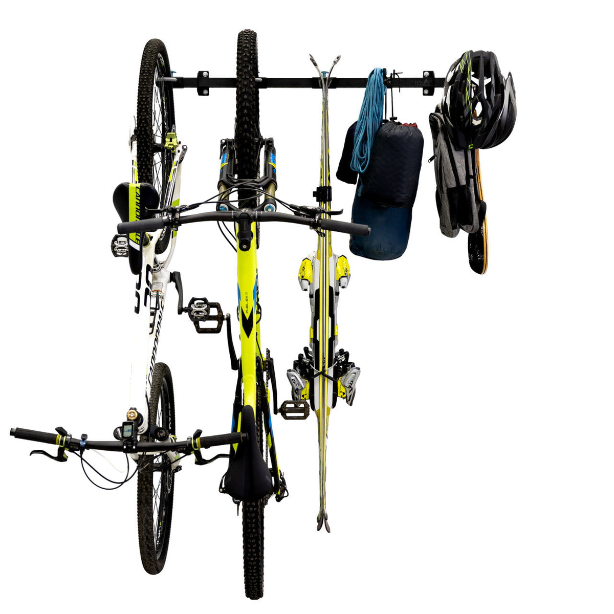 Two bikes, skis, a helmet and a bag on the G-Adventure rack, front view