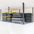 Black 4 x 8 ft overhead ceiling rack holding storage bins and tires