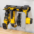 Four-slot power tool organizer holding drills, a grinder and a circular saw