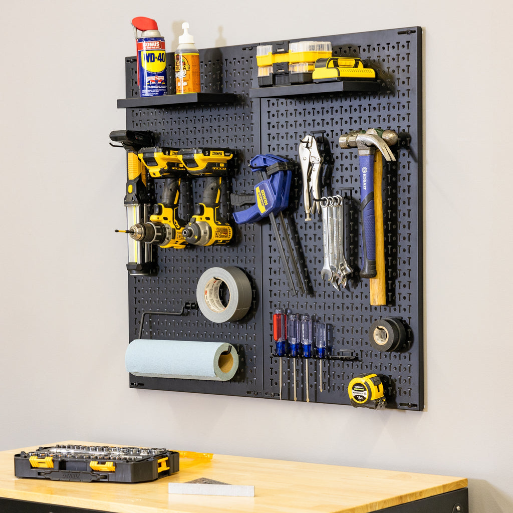 Pegboard with tools mounted above the folding workbench