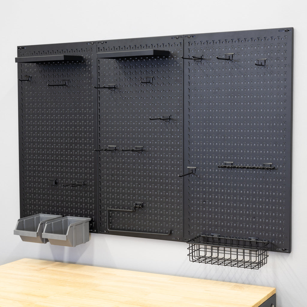 Empty 51 x 32 inch black pegboard with shelves, bins and a wire basket