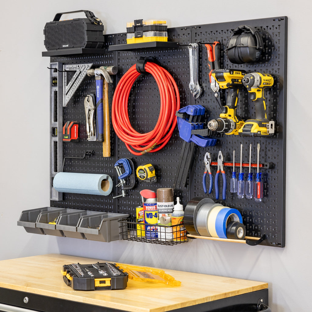 PRO pegboard with shelves, hooks, bins and a magnetic strip holding tools above a workbench