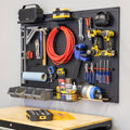 PRO pegboard with shelves, hooks, bins and a magnetic strip holding tools above a workbench