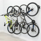 Four bikes on swivel wall hooks, angled view
