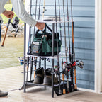 Man taking a rod from the stand holding a tackle bag and boots