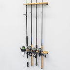 Fishing rods stored vertically on the wood rack