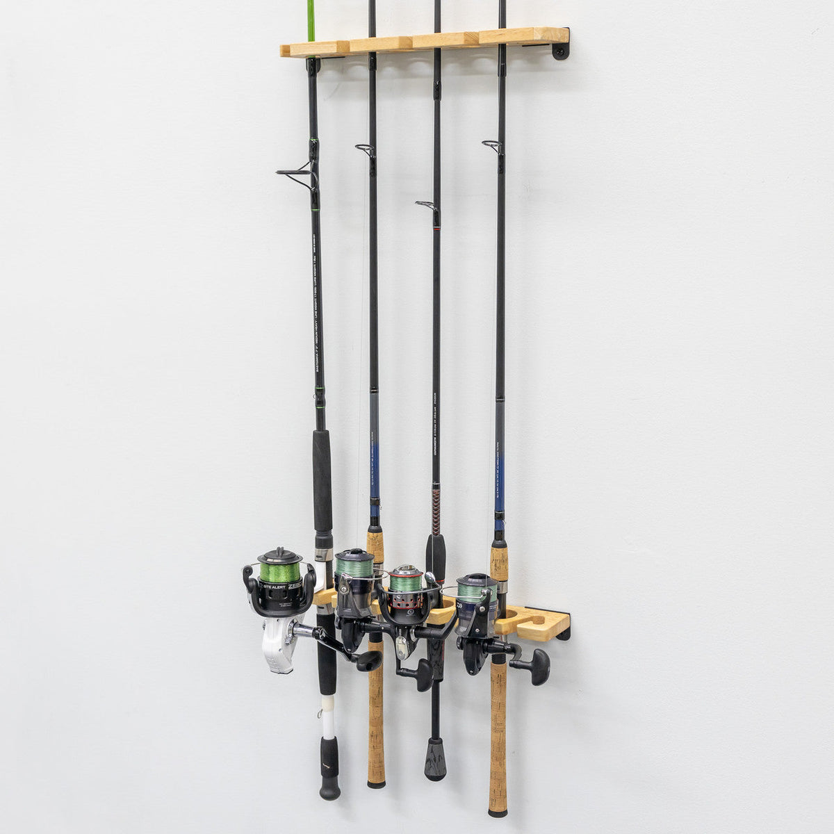 Fishing rods stored vertically on the wood rack