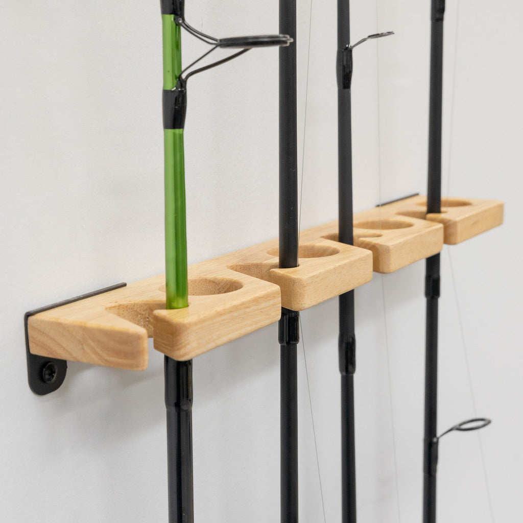 Close-up of rods standing in the wood rack slots