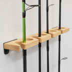 Close-up of rods standing in the wood rack slots