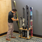 Man placing skis in the Silverton ski rack