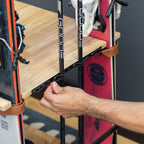 Hand fastening a ski in the Silverton rack strap