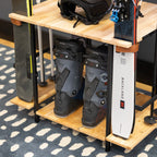 Close-up of ski boots on the Silverton rack base between skis