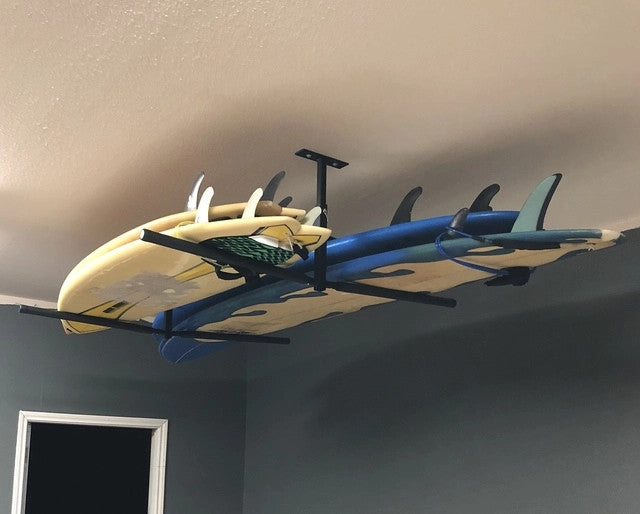Surfboards and paddleboards stored on the Hi-Port 2 ceiling rack