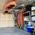Kayaks stored overhead on the Hi-Port 2 ceiling rack in a garage
