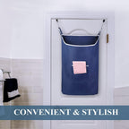 Navy laundry hamper hanging behind a bathroom door