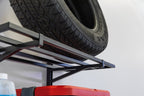 Close-up of a tire stored on a black wall shelf
