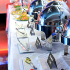 Black chalkboard tent signs beside covered buffet dishes