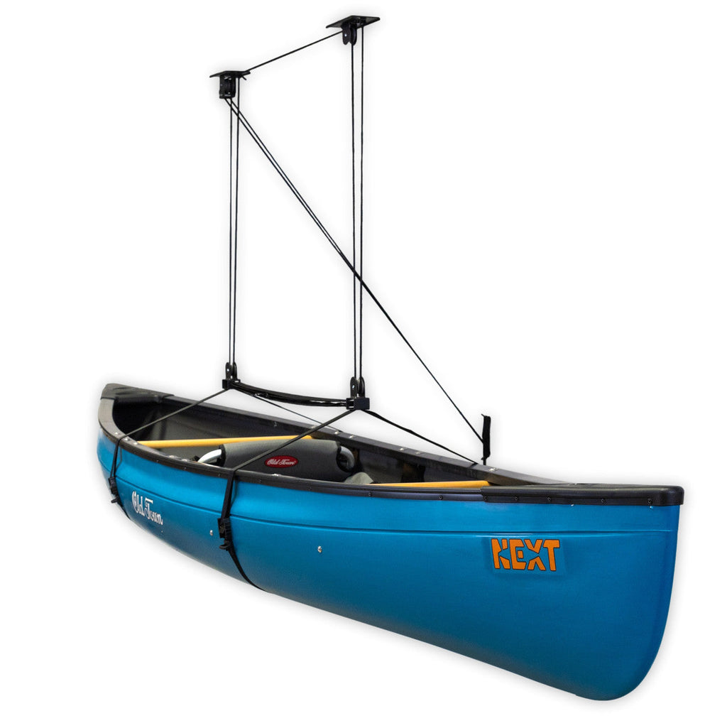 Blue canoe lifted by the garage pulley hoist