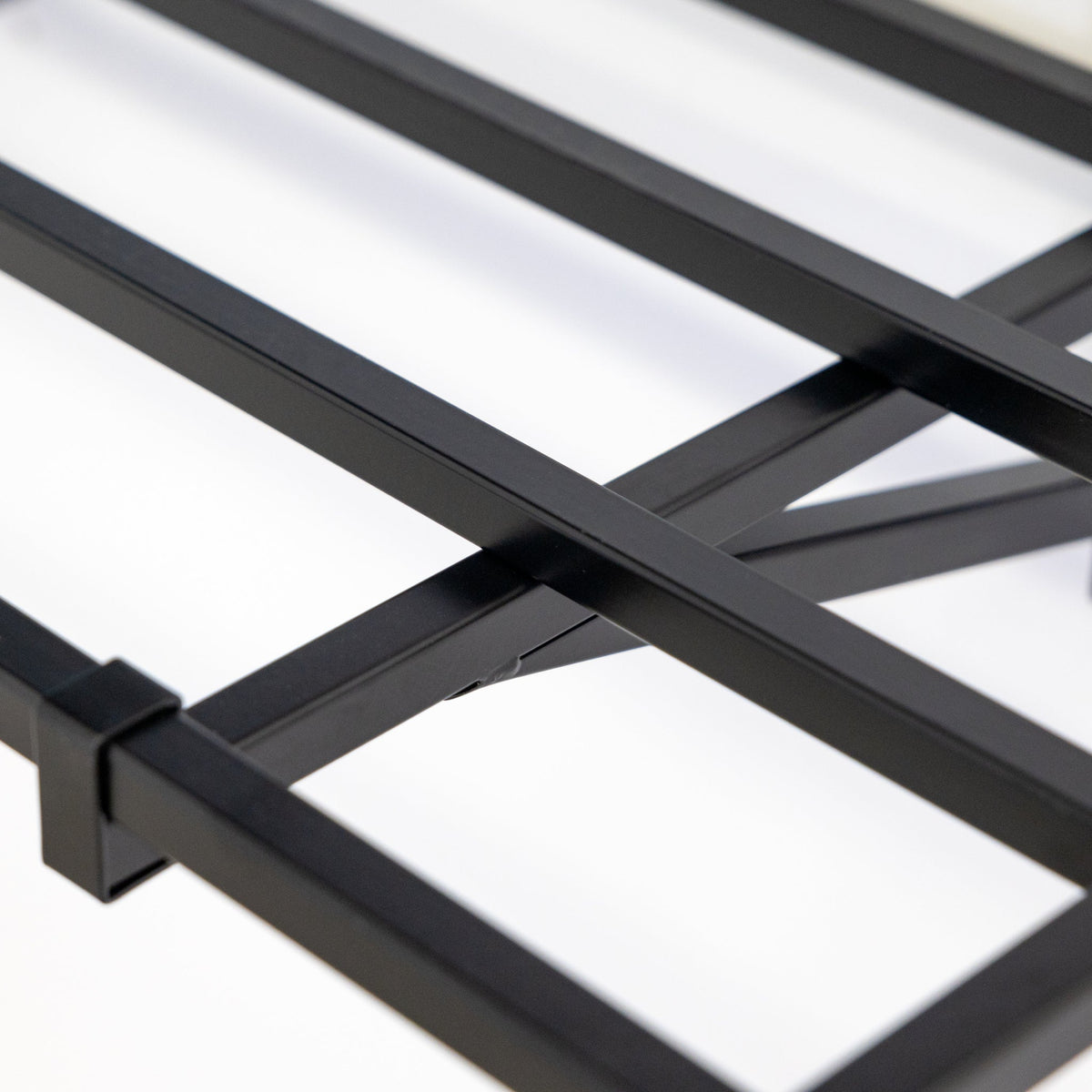 Close-up of the black steel shelf frame and bracket