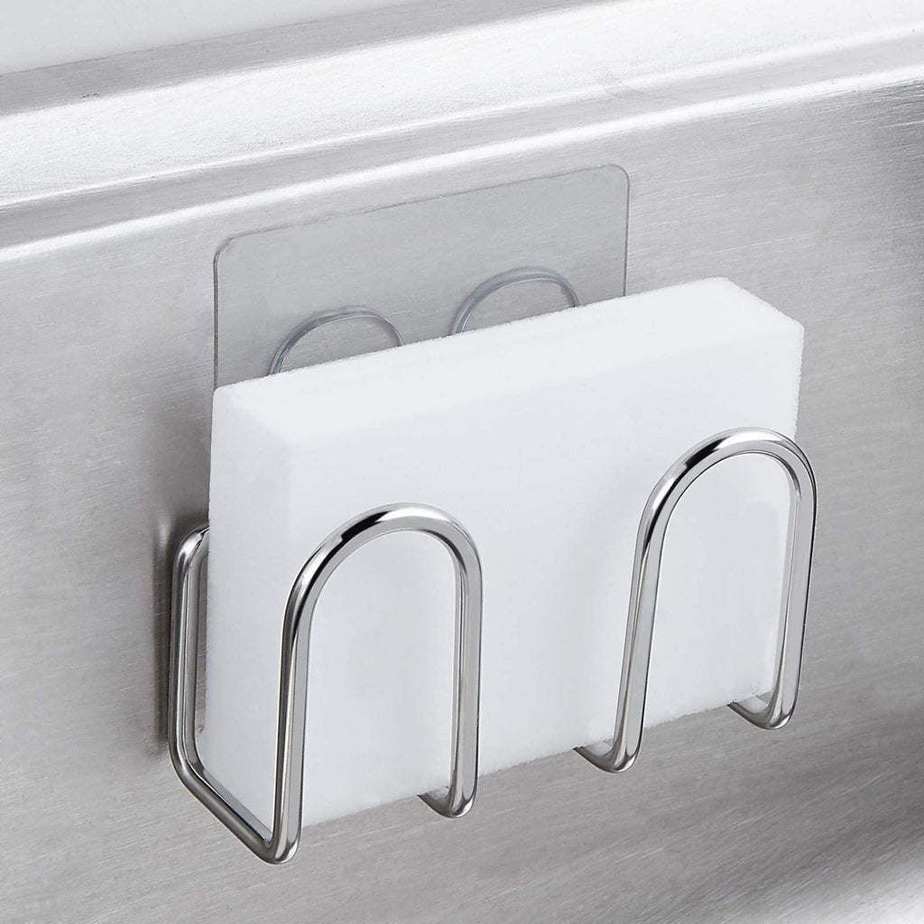Stainless steel adhesive sponge holder mounted inside a sink and holding a white sponge