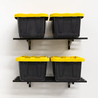 Four storage totes on two black 1 x 2 ft wall shelves, front view