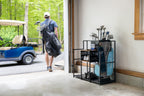 Man carrying a golf bag to the double organizer