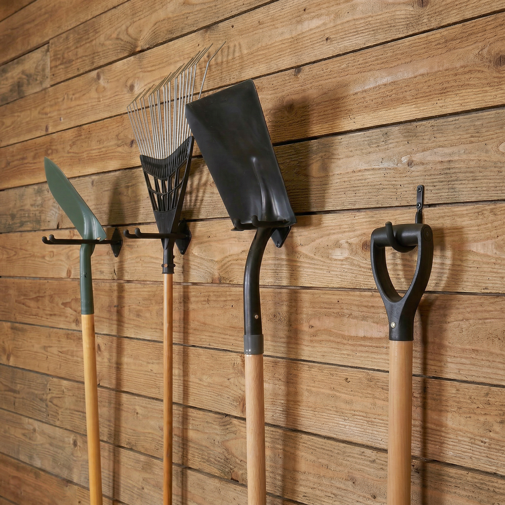 Yard tools hanging on Simple Hooks on a wood plank wall