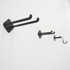 Large, medium and small double hooks and a mini J hook mounted on a wall