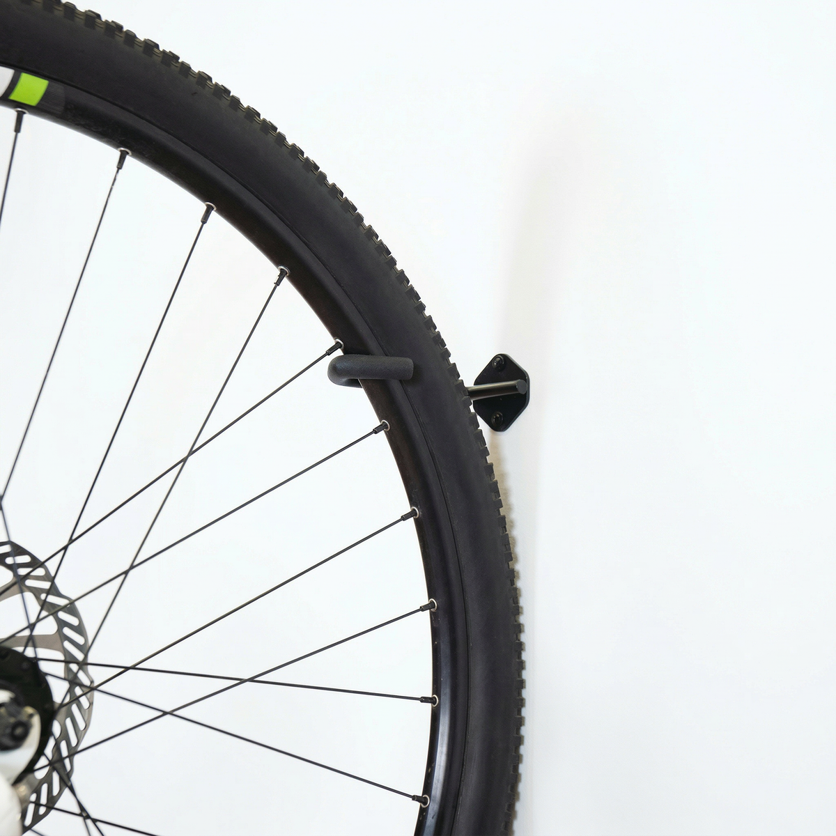 Bike wheel hanging on a Simple Hooks bike hook
