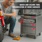 Red magnetic labels on a stainless steel rolling tool cart in a home garage