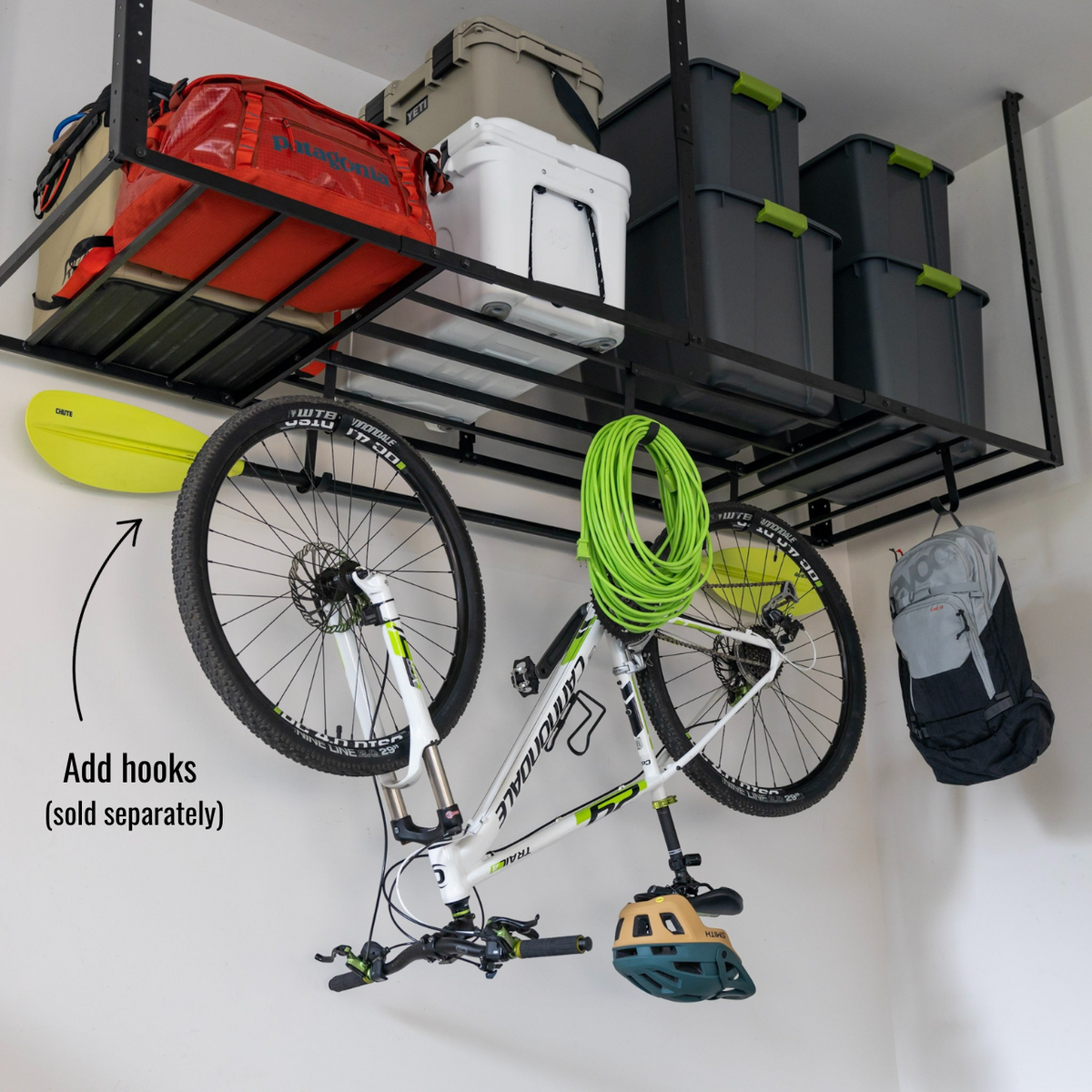 Overhead ceiling rack with bins and add-on hooks (sold separately) holding a bike, hose and helmet