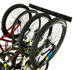 Close-up of bike wheels resting in the rack hooks