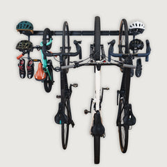 Four bikes with helmets and gear hanging on the BLAT modular rack
