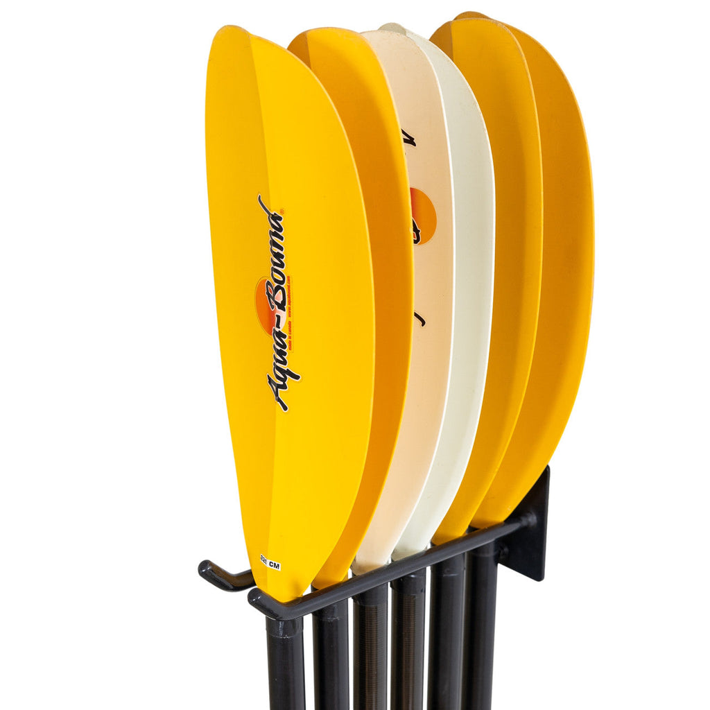Six kayak paddles hanging on the Laurel Lake paddle wall hook