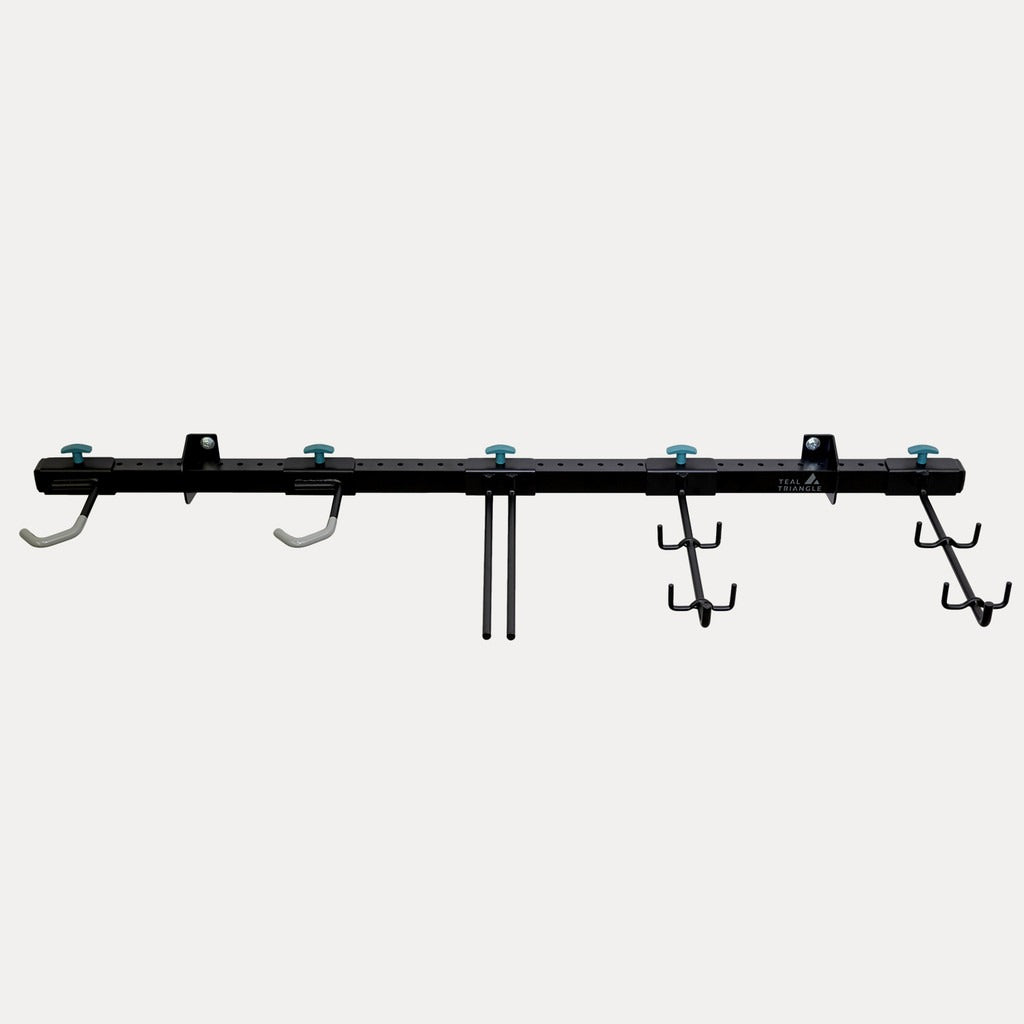 Empty G-Adventure wall rail with adjustable hooks