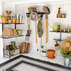 Shed with a garden tool organizer, shelves, plants and boots