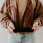 Woman holding the matte black stoneware tray