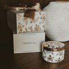 Gold Delft trinket box beside its gift box