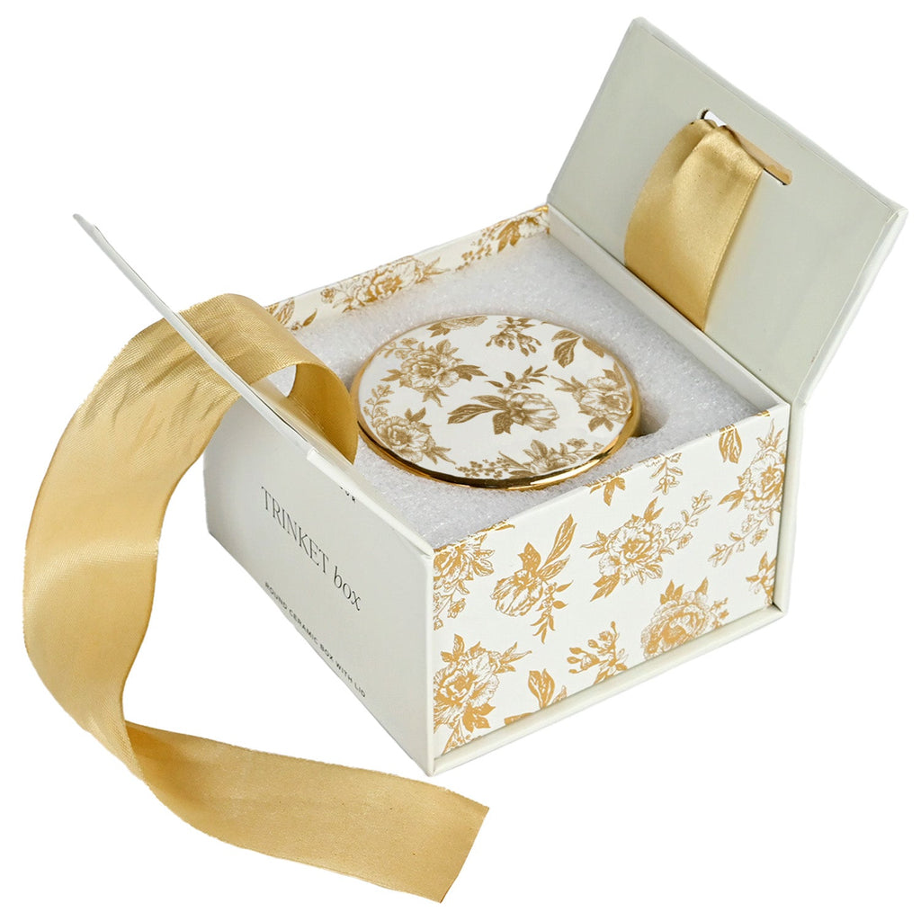 Gold Delft trinket box inside its open gift box