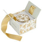 Gold Delft trinket box inside its open gift box