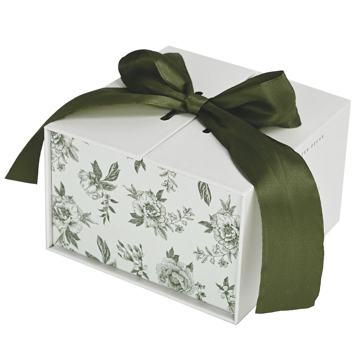 Green Delft trinket box gift packaging tied with a green ribbon