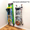 High Capacity LadderStacker kit holding two ladders and a hose on a wall