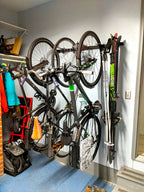 Bikes and gear stored on the G-Adventure rack in a narrow storage room