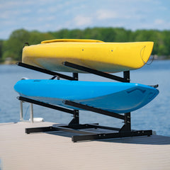 Two kayaks on the black 2-level kayak rack on a dock
